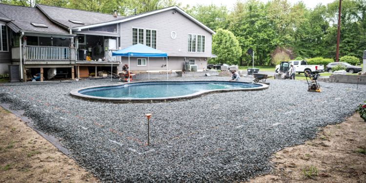 Cross-section showing 8-10 inches of compacted crushed stone base for paver pool deck installation